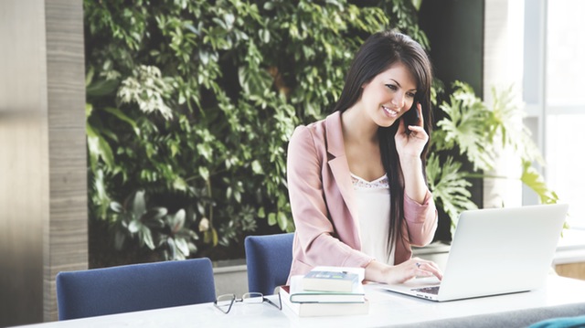 Woman talking on telephone