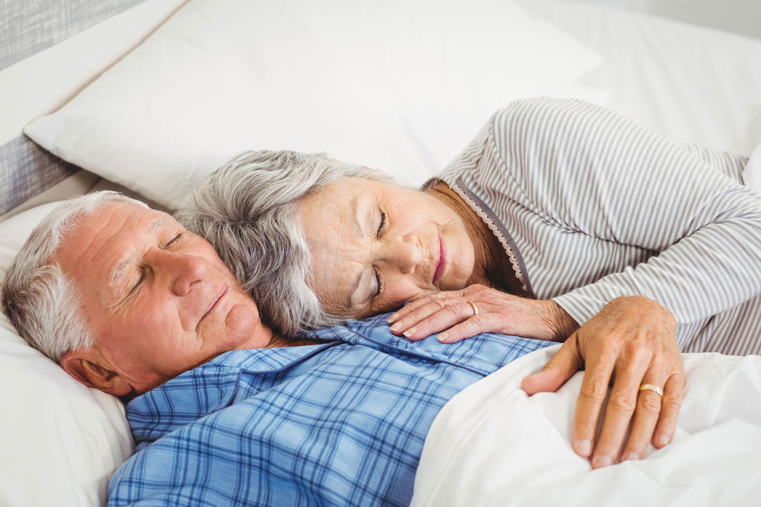 senior couple sleeping